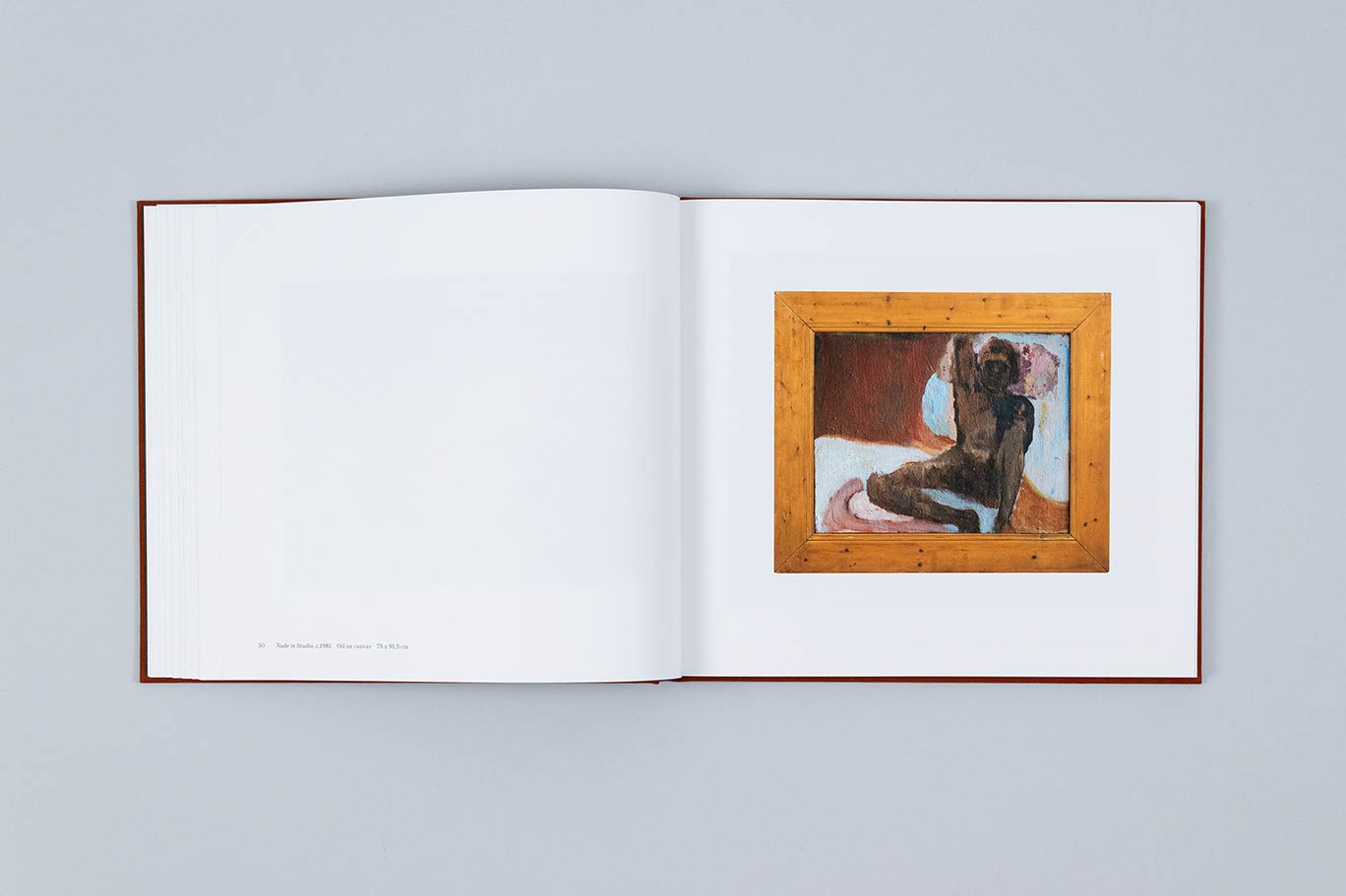 Carole Gibbons monograph spread showing an oil painting of a nude male life model, housed in a chunky wooden frame