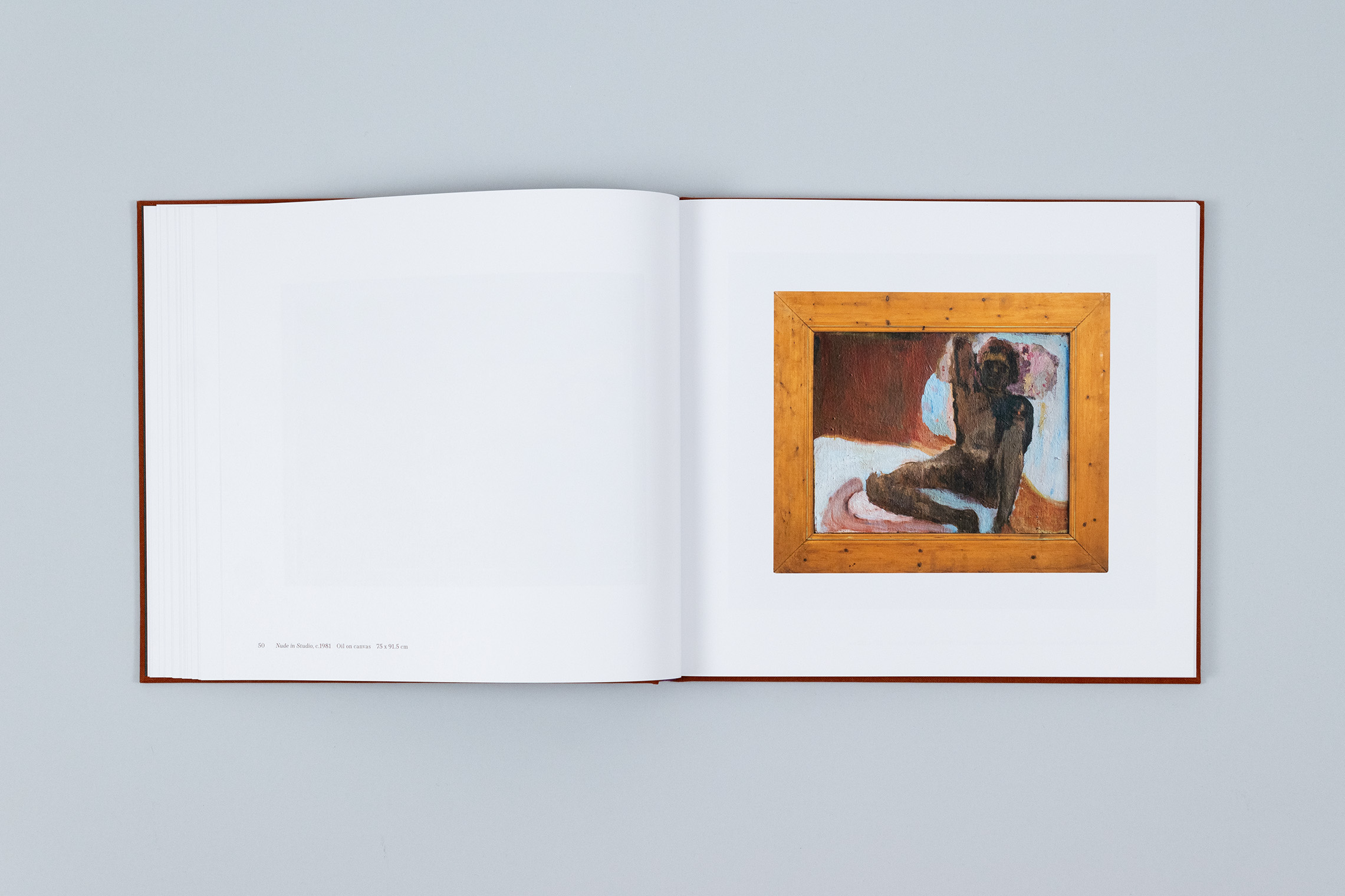 Carole Gibbons monograph spread showing an oil painting of a nude male life model, housed in a chunky wooden frame