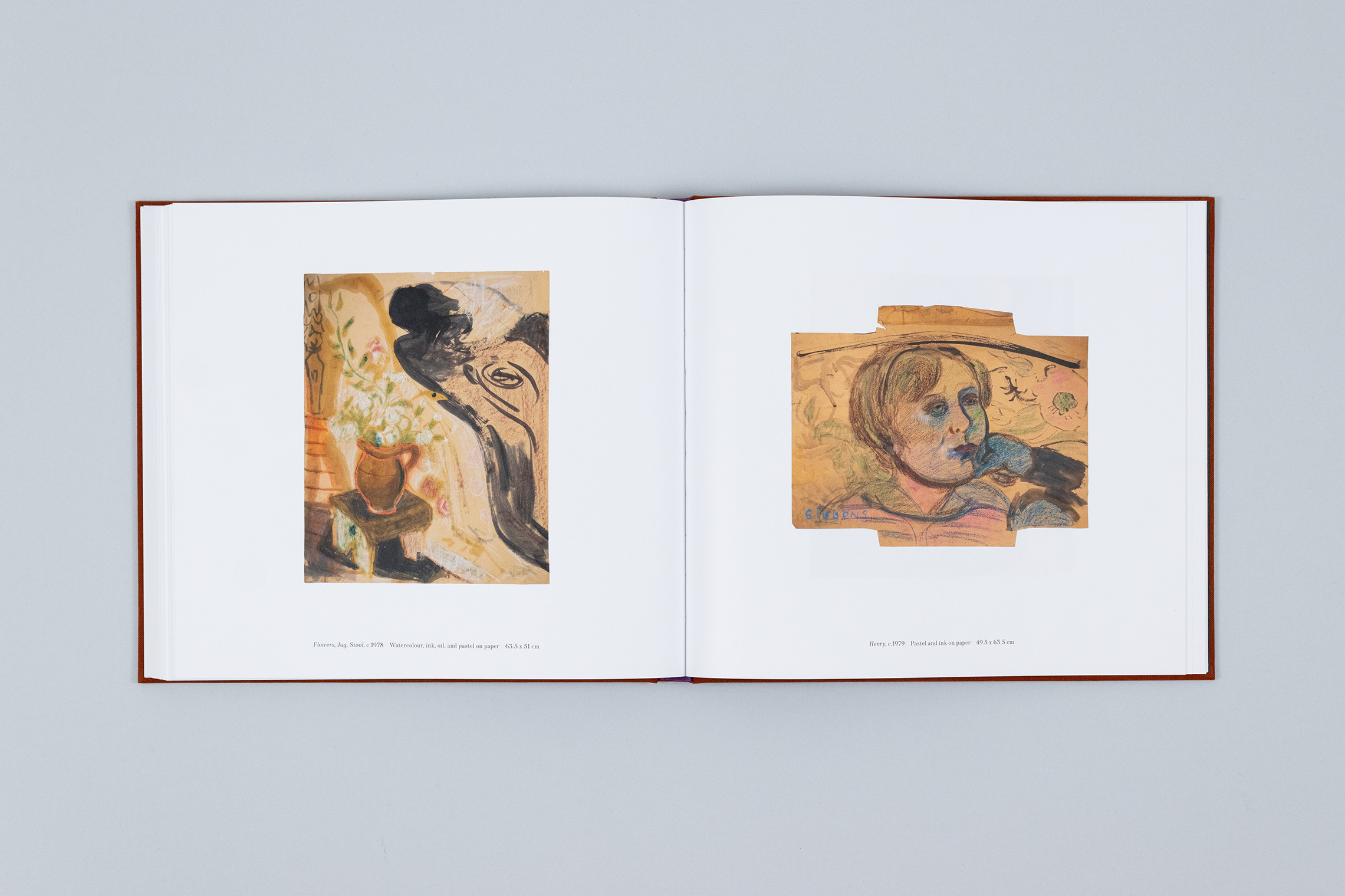 Carole Gibbons monograph spread with two works on paper over the pages, a portrait of her young son Henry on the right